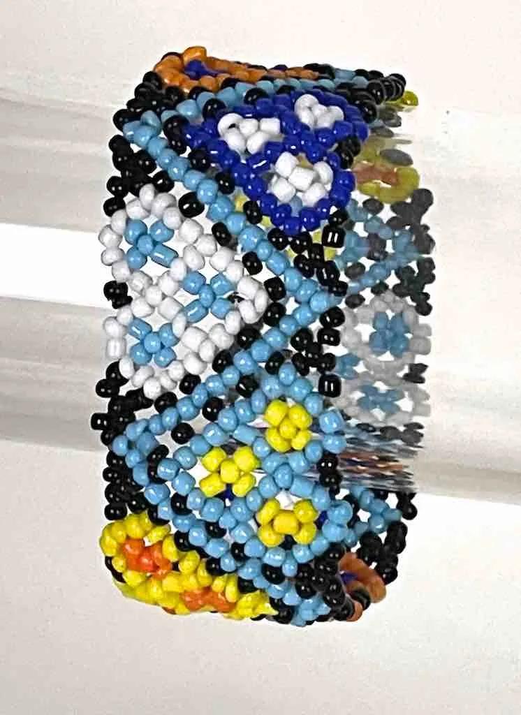 Small bead wide woven floral design beaded bracelet - Togo